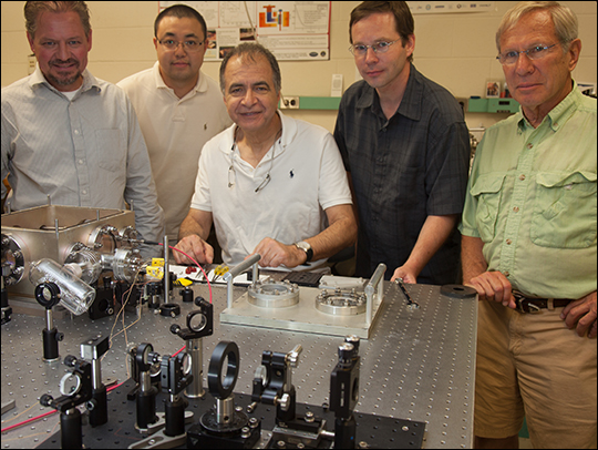 Photo. Solid-state optical cryocooler characterization at the University of New Mexico (UNM) collaborator laboratory. Pictured from left to right are Markus Hehlen (MST-7), and UNM collaborators Junwei Meng, Mansoor-Sheik Bahae, Alexander Albrecht, and Richard Epstein.