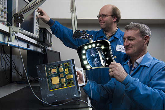 Photo. (Left): Paul Graham (Space Data Science & Systems, ISR-3) and Robert Merl (Space Electronics and Signal Processing, ISR-4) work on the Rad-Hard SBC for Command and Data Handling.